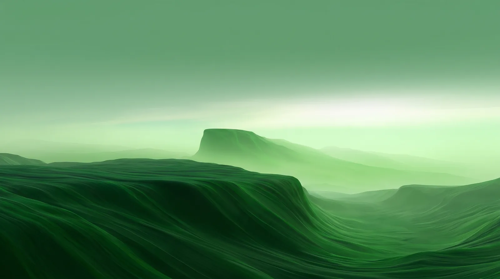 Soft green waves beneath a luminous misty horizon
